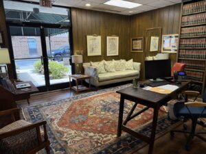 Reception area at Kendall Page Attorney office in Chapel Hill with law books and comfortable seating